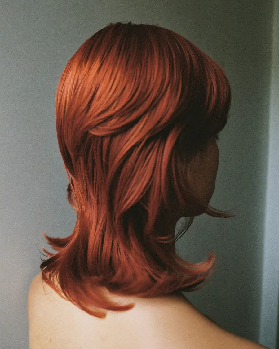 Long layers coloured a natural copper red.